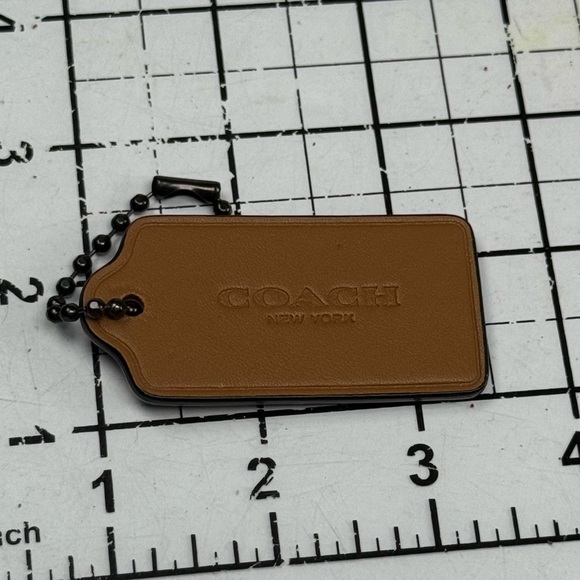 Coach Tan and snake embossed. Two tone. Leather hang tag.  3.5 by 1.25 inches. - Picture 3 of 3